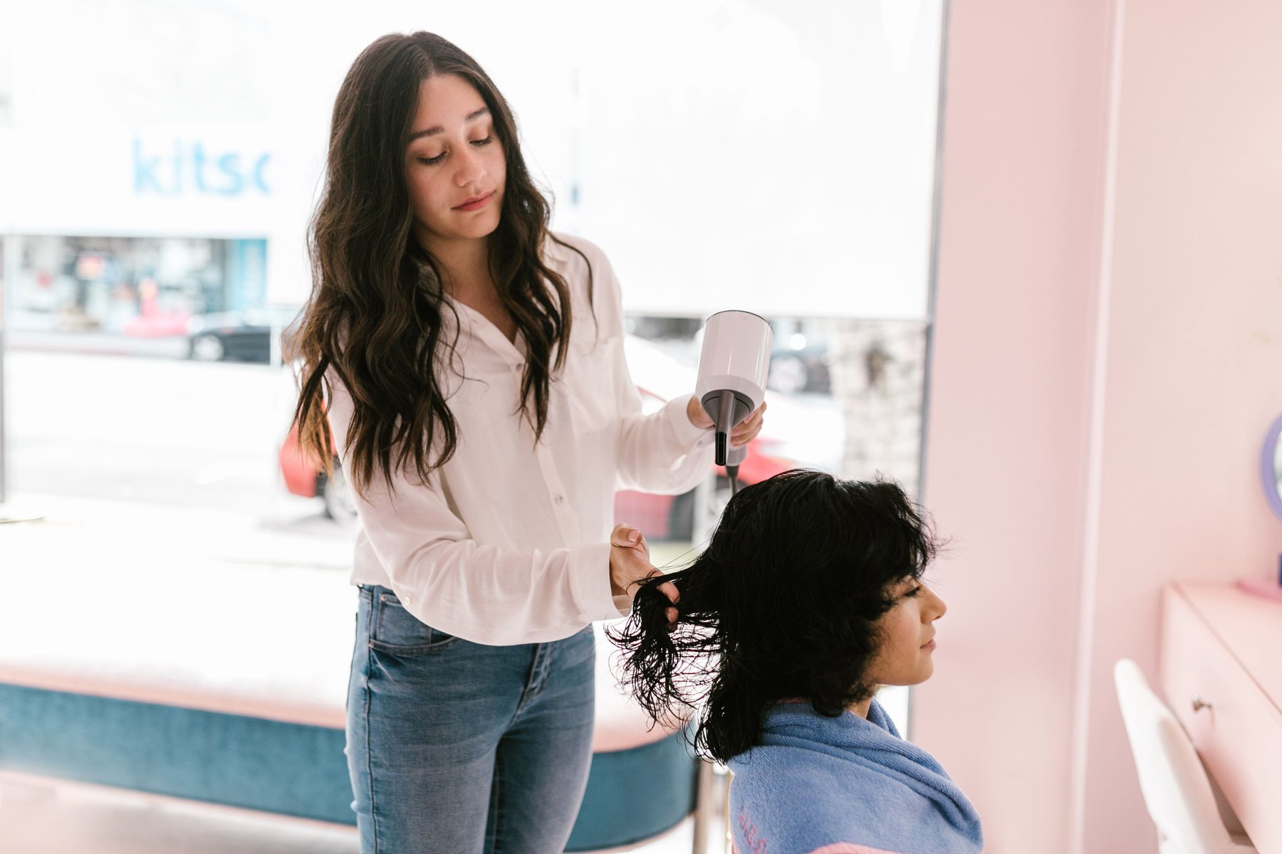 Hair stylist working with a client