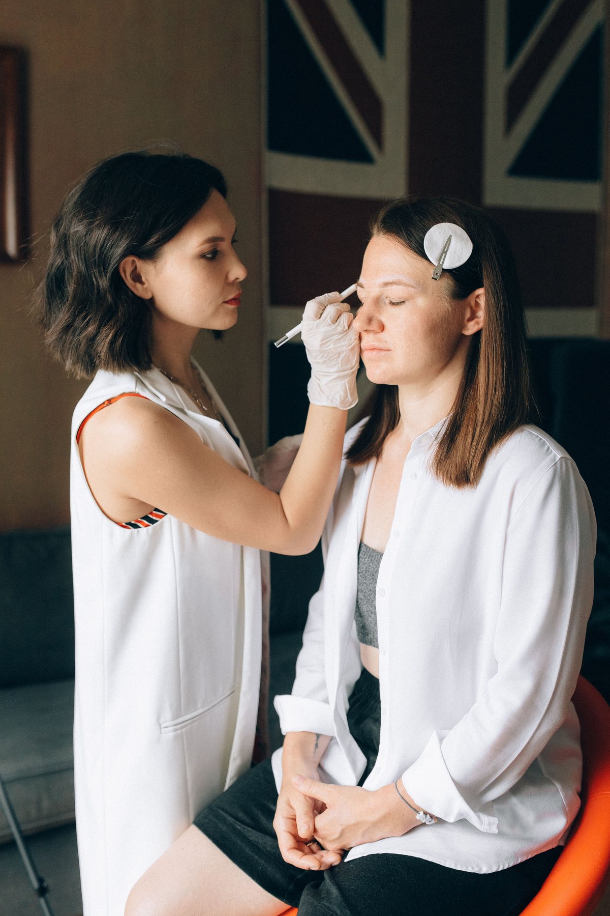 Makeup artist working with a client