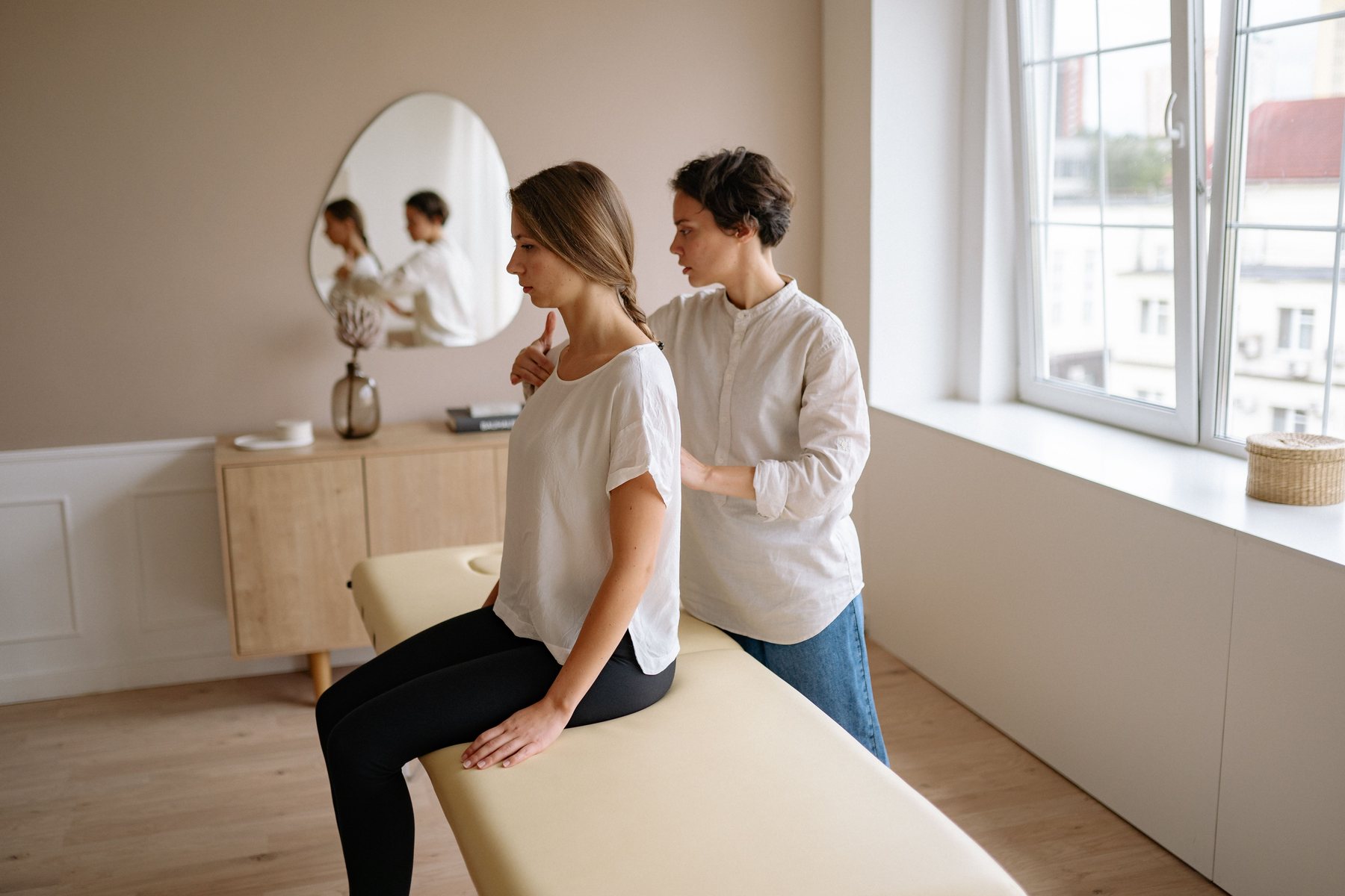 Wellness professional providing a massage