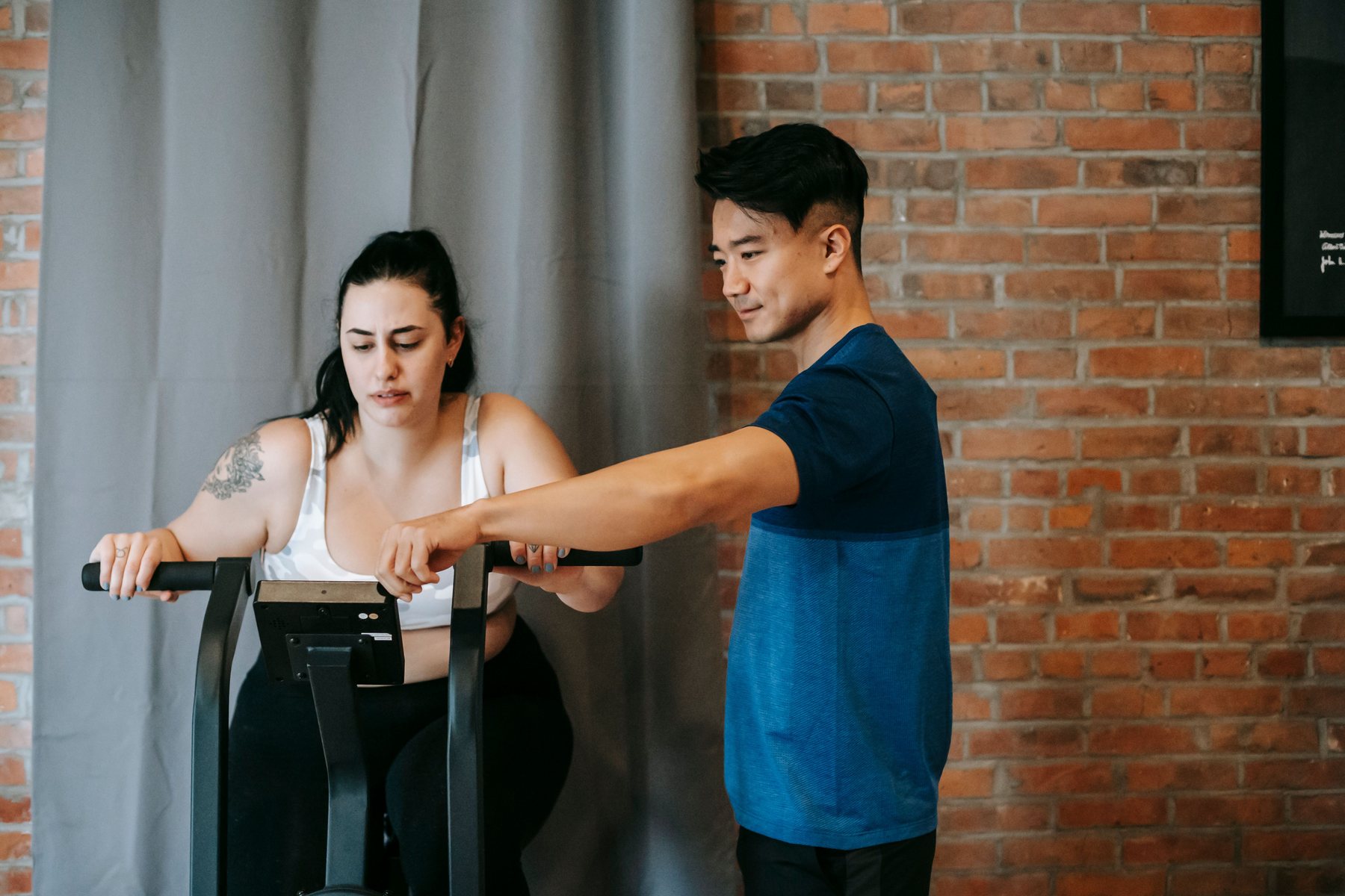 Personal trainer guiding a client
